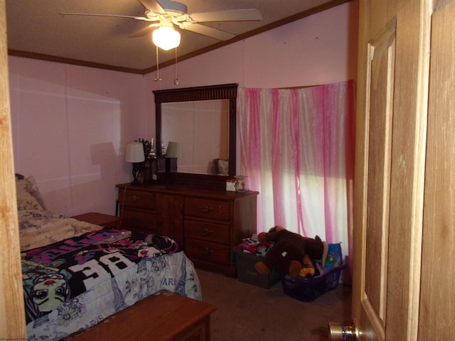 bedroom featuring lofted ceiling, crown molding, carpet flooring, and ceiling fan