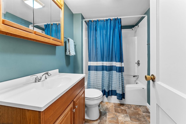 full bathroom with vanity, shower / bath combo with shower curtain, and toilet