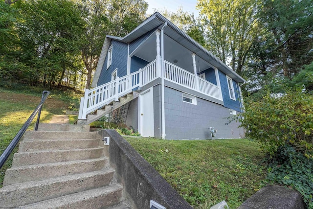 view of property exterior featuring a yard