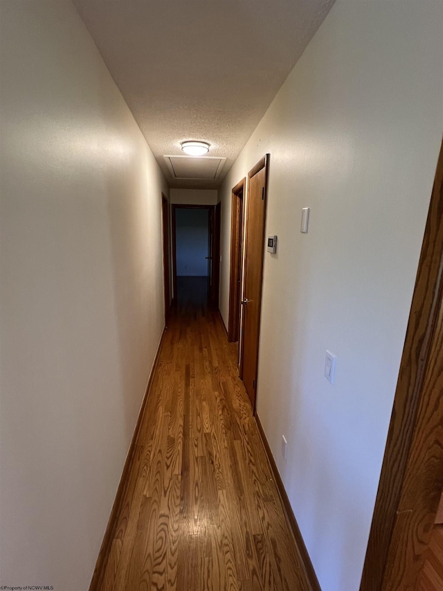 hall with wood finished floors