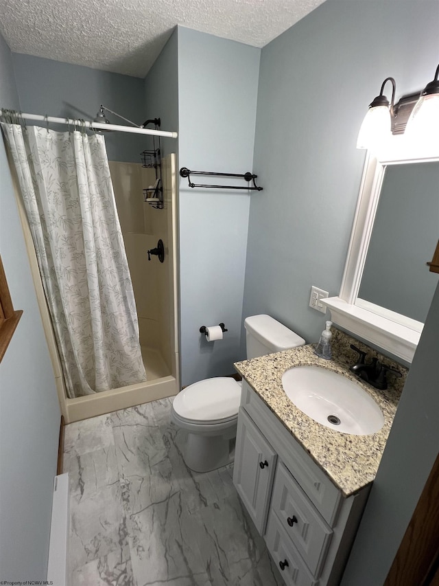 bathroom with marble finish floor, toilet, vanity, a textured ceiling, and a stall shower