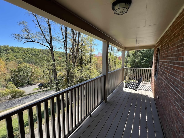 deck featuring a view of trees