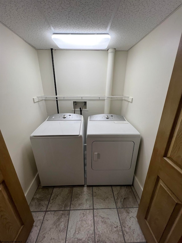 clothes washing area with washer and dryer