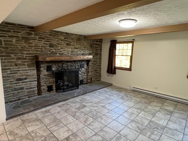 unfurnished living room with a textured ceiling, baseboards, beamed ceiling, baseboard heating, and a stone fireplace