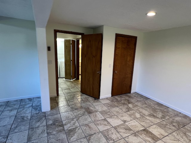 unfurnished bedroom with washer / dryer, a closet, baseboards, and recessed lighting