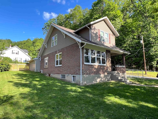 view of home's exterior with a lawn