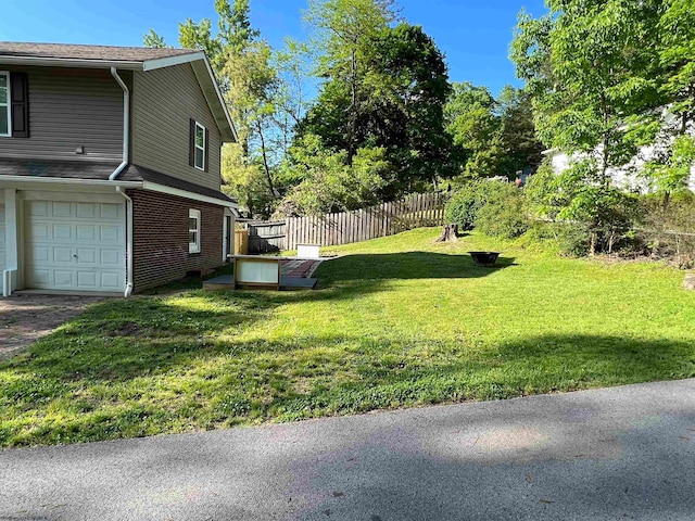 view of yard featuring a garage