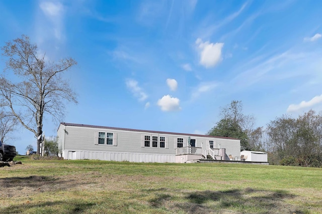 back of house with a yard