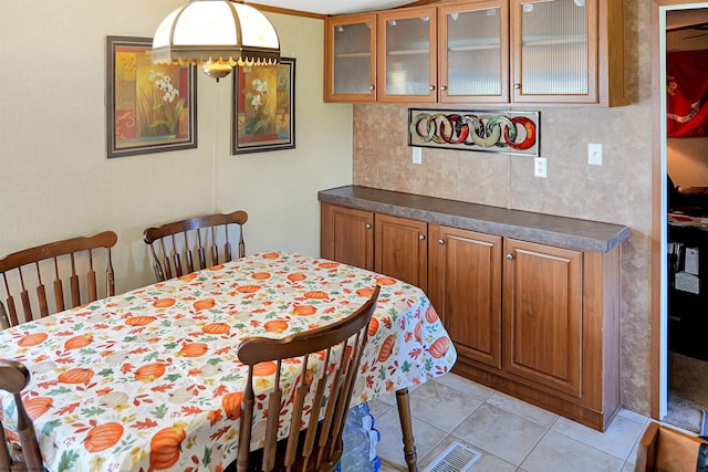 dining room with light tile patterned flooring