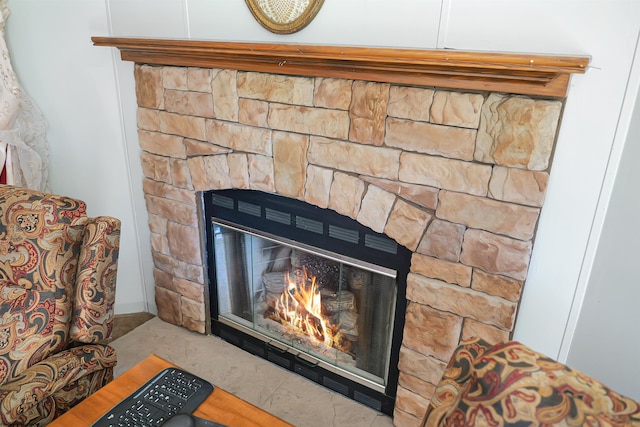 interior details with a stone fireplace