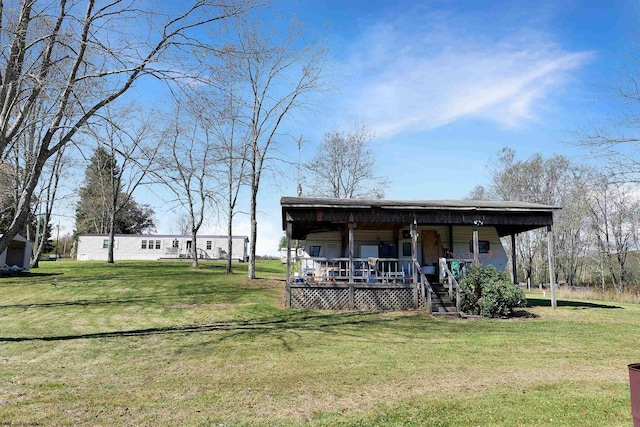 view of outdoor structure with a porch and a lawn