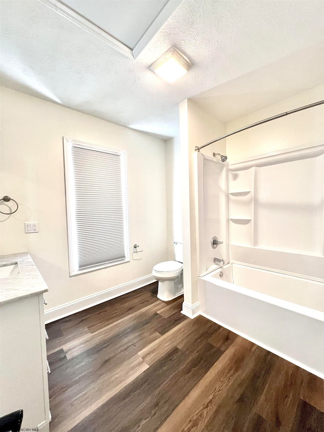 full bathroom with vanity, toilet, hardwood / wood-style flooring, and shower / washtub combination