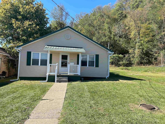 bungalow-style house with a front lawn