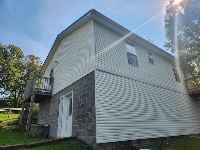 view of home's exterior with a balcony