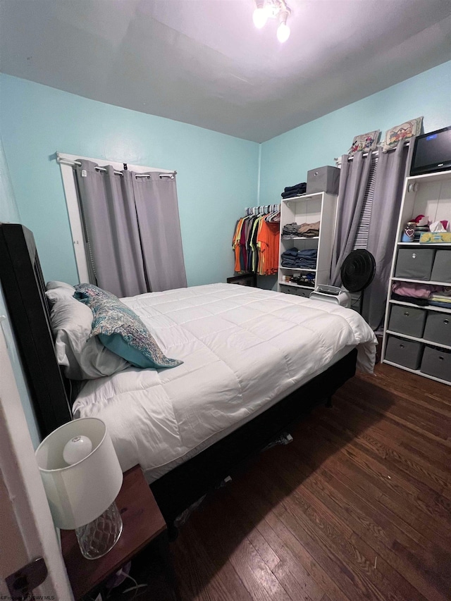 bedroom featuring dark hardwood / wood-style floors