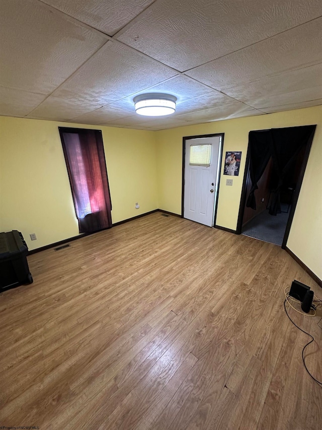 spare room featuring light hardwood / wood-style flooring