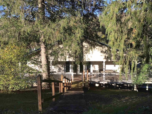 rear view of property with a deck