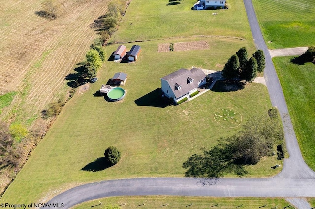 birds eye view of property with a rural view