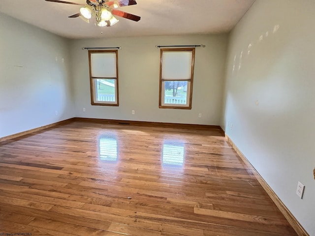 empty room featuring ceiling fan and light wood-type flooring