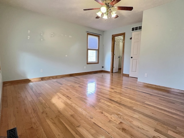 spare room featuring ceiling fan and light wood-type flooring