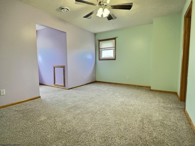 carpeted empty room with ceiling fan