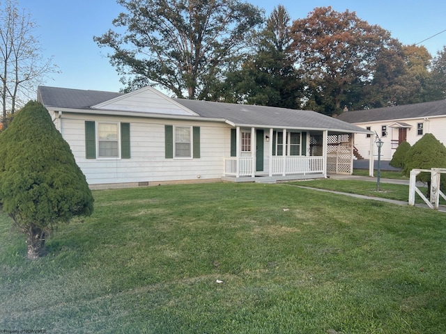 single story home with a front lawn and covered porch