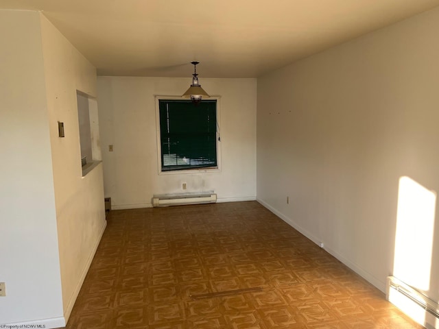 unfurnished dining area featuring parquet floors and baseboard heating