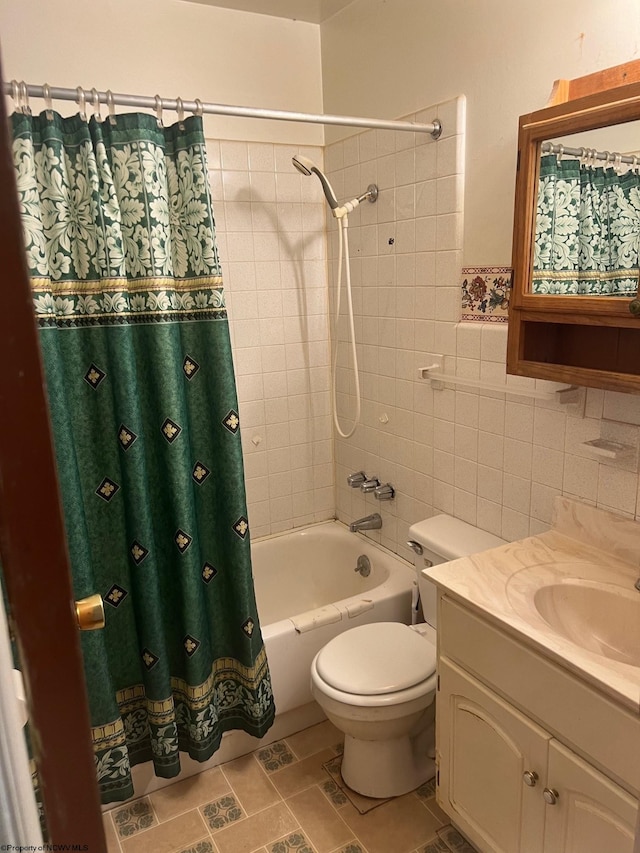 full bathroom featuring shower / bath combination with curtain, vanity, tile walls, and toilet