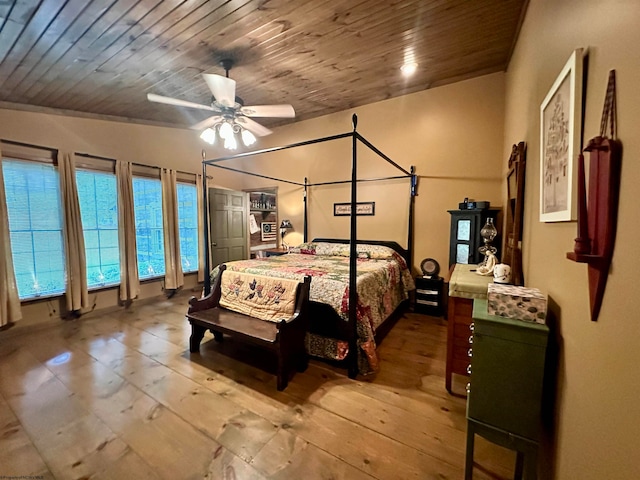 bedroom featuring vaulted ceiling, ceiling fan, and wooden ceiling