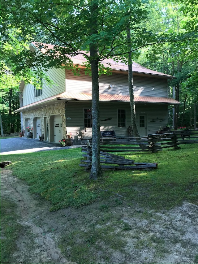 view of front of house with a garage and a front yard