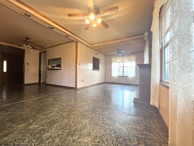 interior space featuring ceiling fan and a textured ceiling