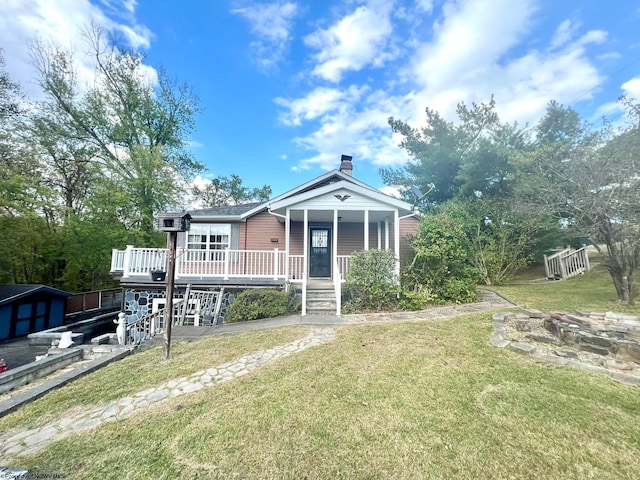 bungalow-style home featuring a front yard