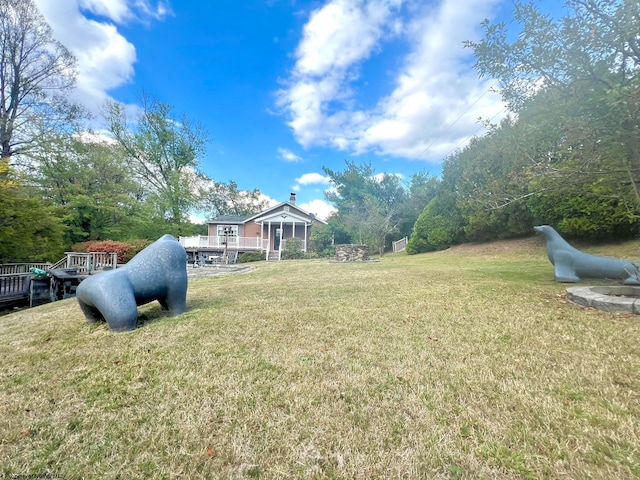 view of yard featuring a wooden deck