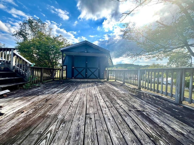 wooden deck featuring a storage shed