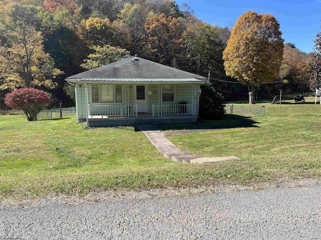 605 Warrior Fork Rd, Mannington, WV 26582 - bungalow-style house featuring a front lawn, covered porch, and fence