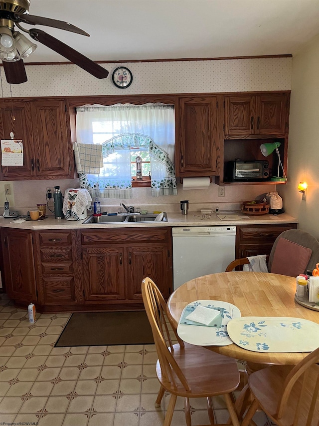 kitchen with dishwasher, sink, and ceiling fan