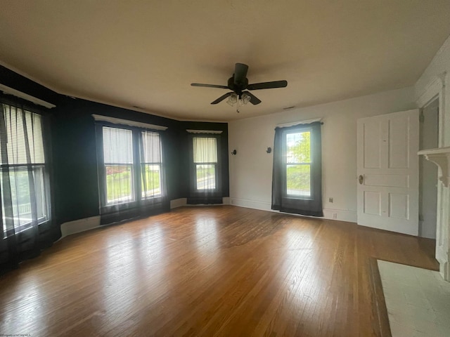 empty room featuring ceiling fan and wood-type flooring