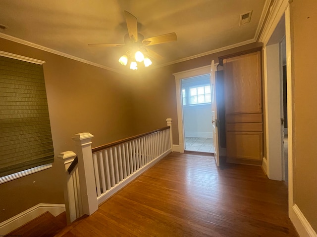 interior space featuring crown molding, hardwood / wood-style flooring, and ceiling fan