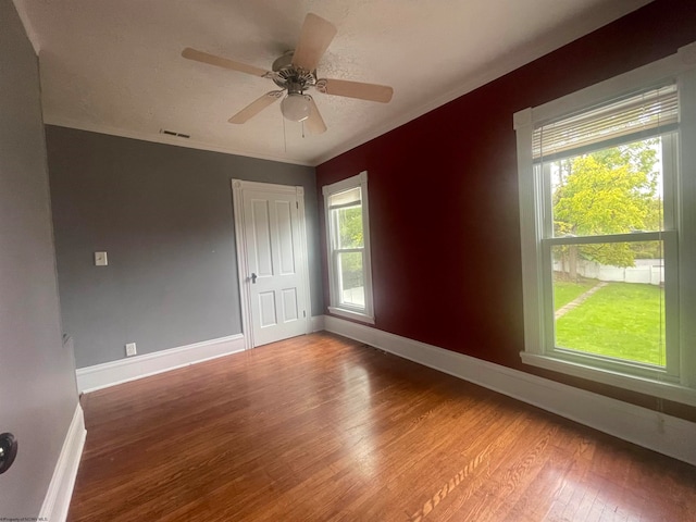 unfurnished room featuring crown molding, hardwood / wood-style flooring, and ceiling fan