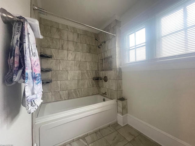 bathroom featuring tiled shower / bath combo