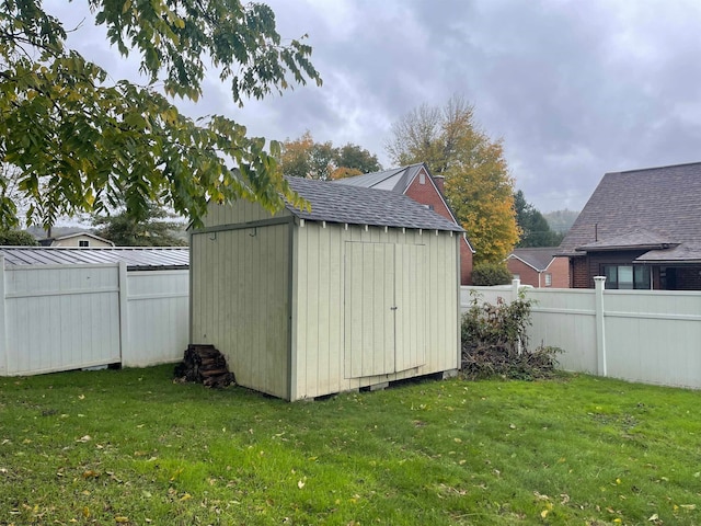 view of outbuilding with a yard