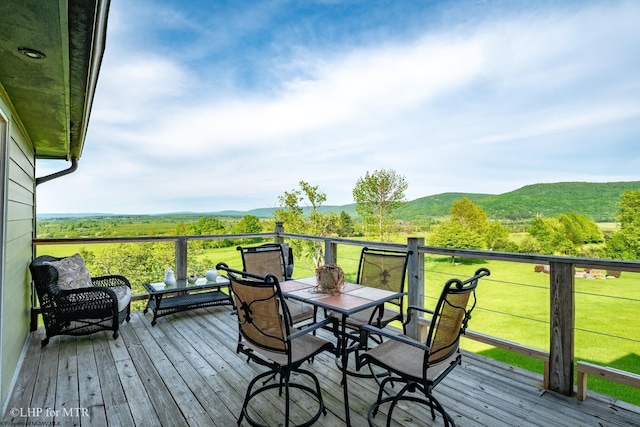 wooden terrace featuring a mountain view