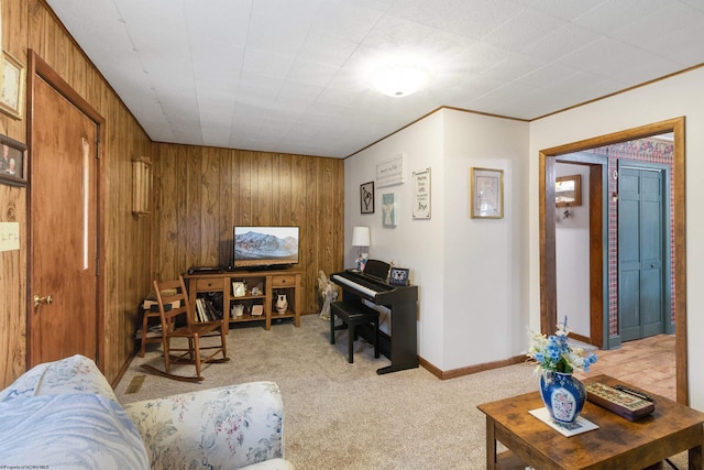 living room featuring wooden walls, crown molding, and light colored carpet