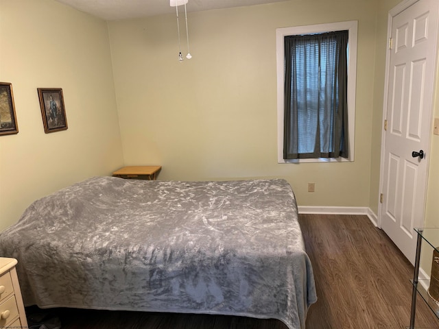 bedroom featuring dark hardwood / wood-style floors