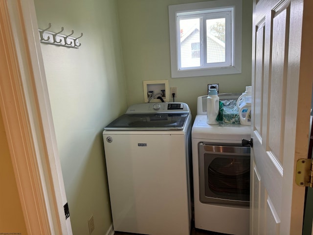 laundry area with washing machine and clothes dryer