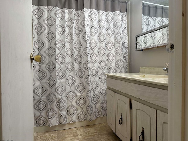 bathroom with vanity and walk in shower