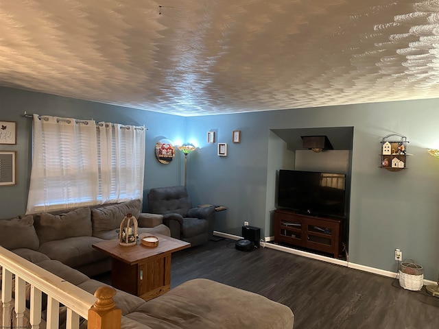 living room featuring a textured ceiling and dark wood-type flooring