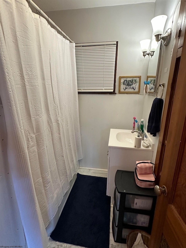 bathroom with vanity and walk in shower