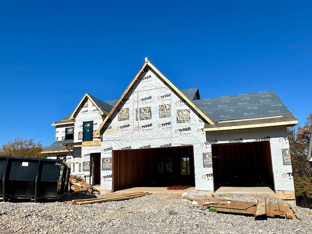 unfinished property featuring a garage