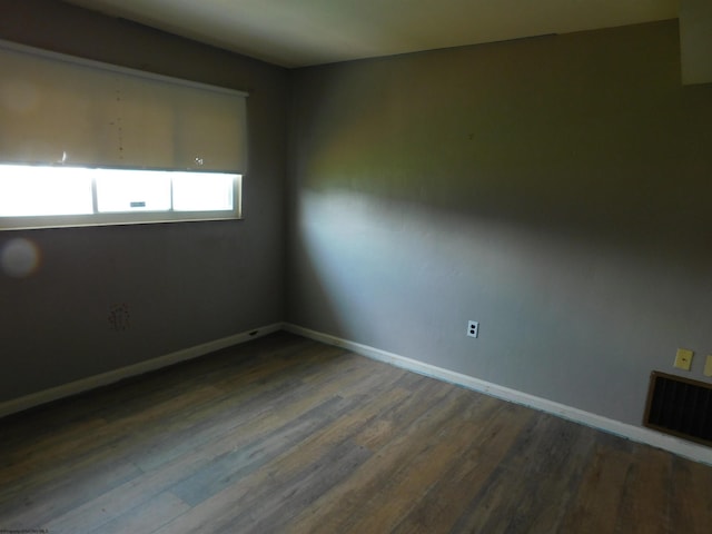 spare room featuring hardwood / wood-style flooring